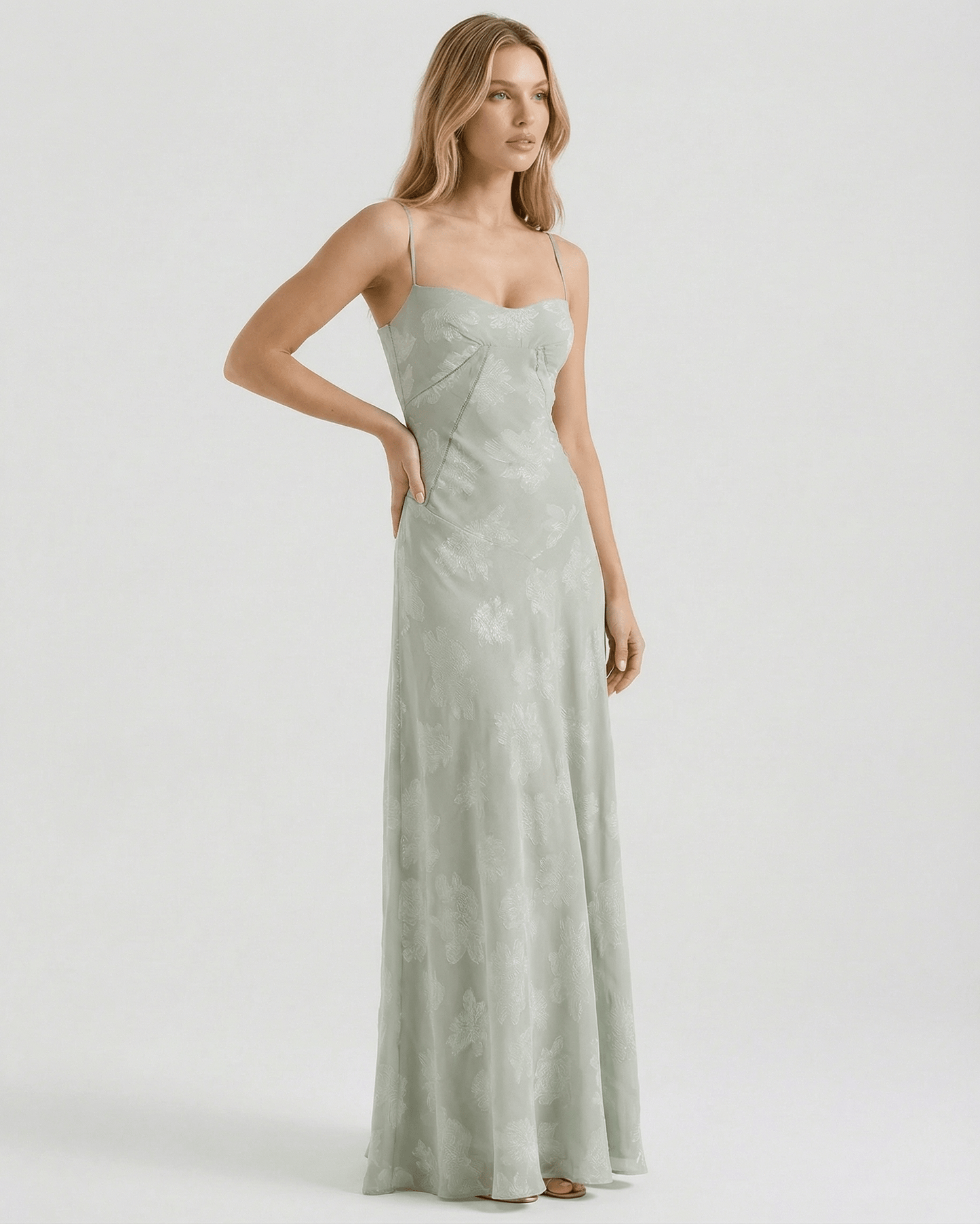 Eliara Maxi Dress by Lauven, featuring a soft sage-green tone and delicate floral print, showcasing a flowing silhouette.