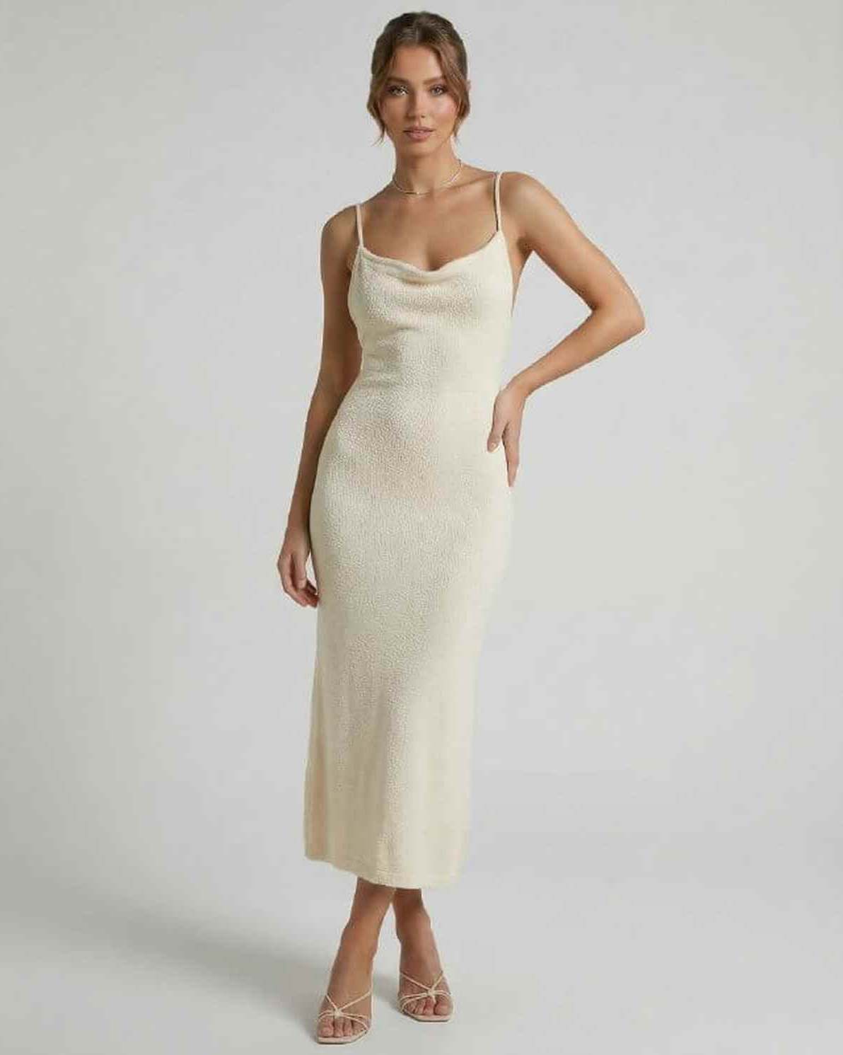 Elowen Midi Dress by Lauven - Cream spaghetti strap midi dress showcasing elegant slim silhouette and soft textured fabric.