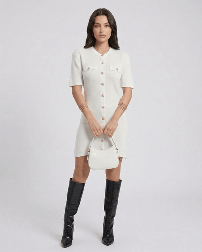 Elysia Mini Dress by Lauven featuring a chic knit design and button closure, styled with knee-high boots and a handbag.