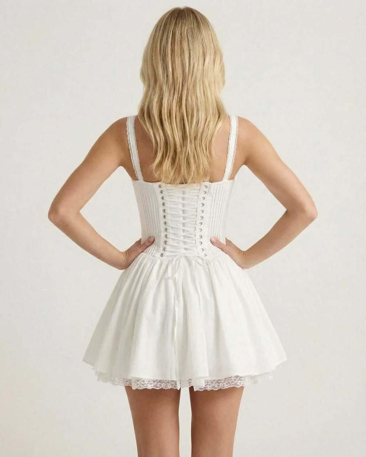 Back view of Elysia Mini Dress by Lauven, featuring a corset bodice and flared skirt in elegant white fabric.