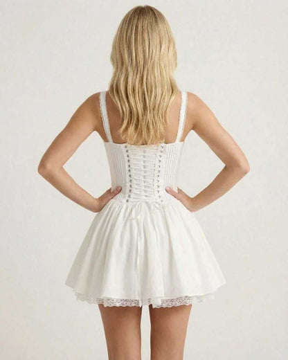 Back view of Elysia Mini Dress by Lauven, featuring a corset bodice and flared skirt in elegant white fabric.