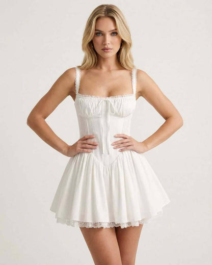Elysia Mini Dress from Lauven featuring a corset bodice and flared skirt in sleek white fabric.