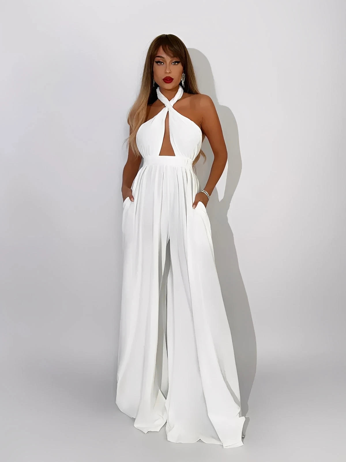 Elegant Elysian Jumpsuit in white featuring a halter neck and cut-out bodice, perfect for summer events.