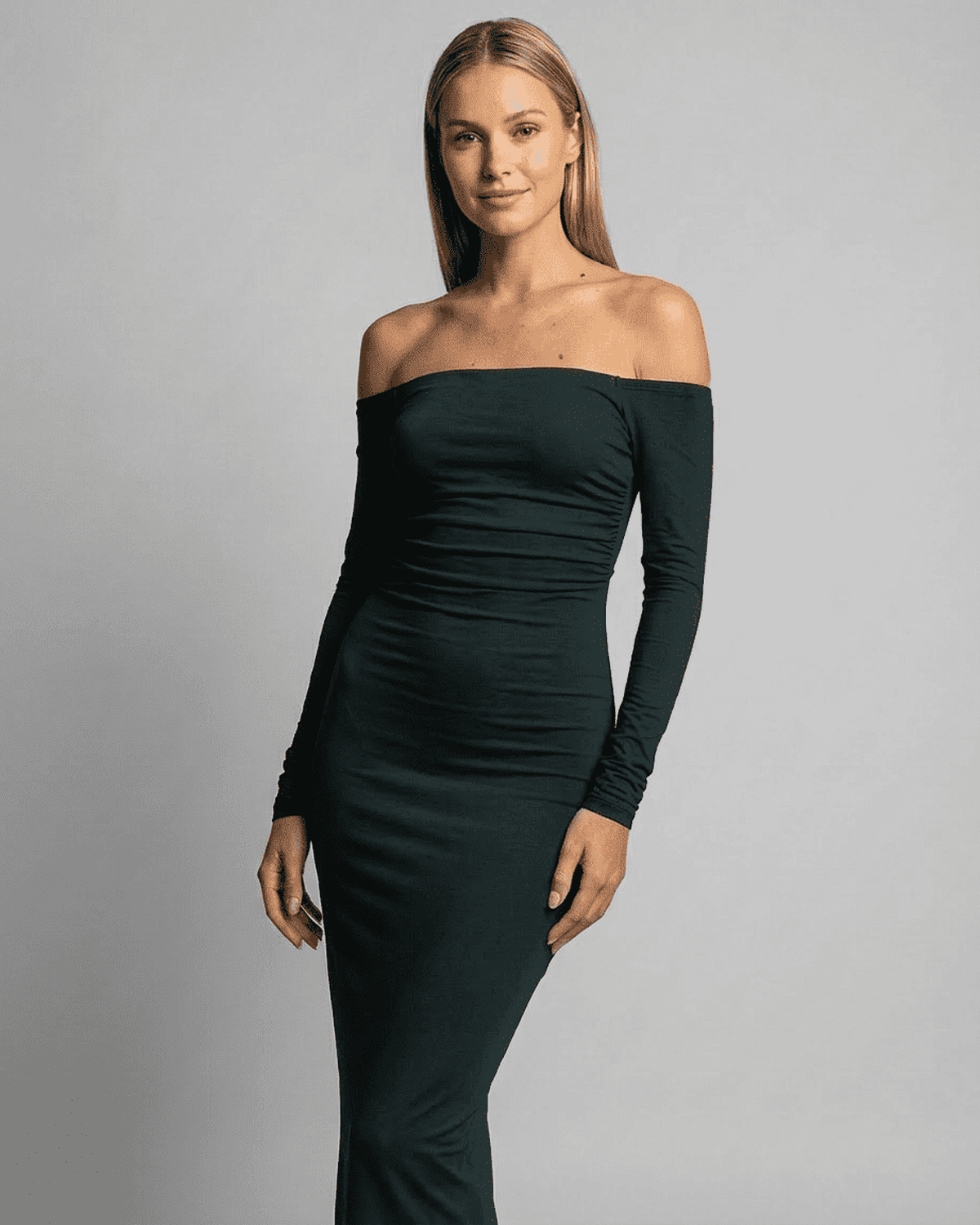Lauven Emerald Maxi Dress featuring off-shoulder design and long sleeves for a sleek, elegant look.