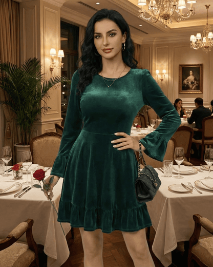 Emeraldia Mini Dress by Lauven worn in deep green velvet with long butterfly sleeves and A-line silhouette.