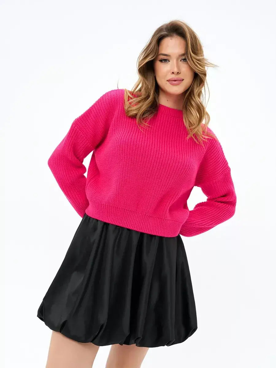 Flamingo Sweater by Lauven in bold fuchsia, showcasing an oversized knit style worn with a black skirt.