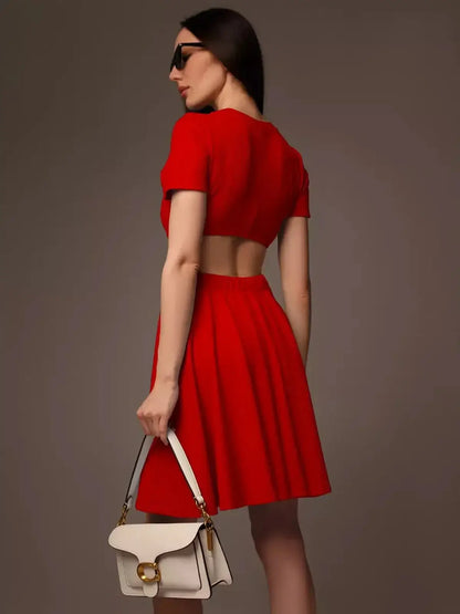 Model showcasing a bold red flare cutout mini dress, perfect for summer events and special occasions.