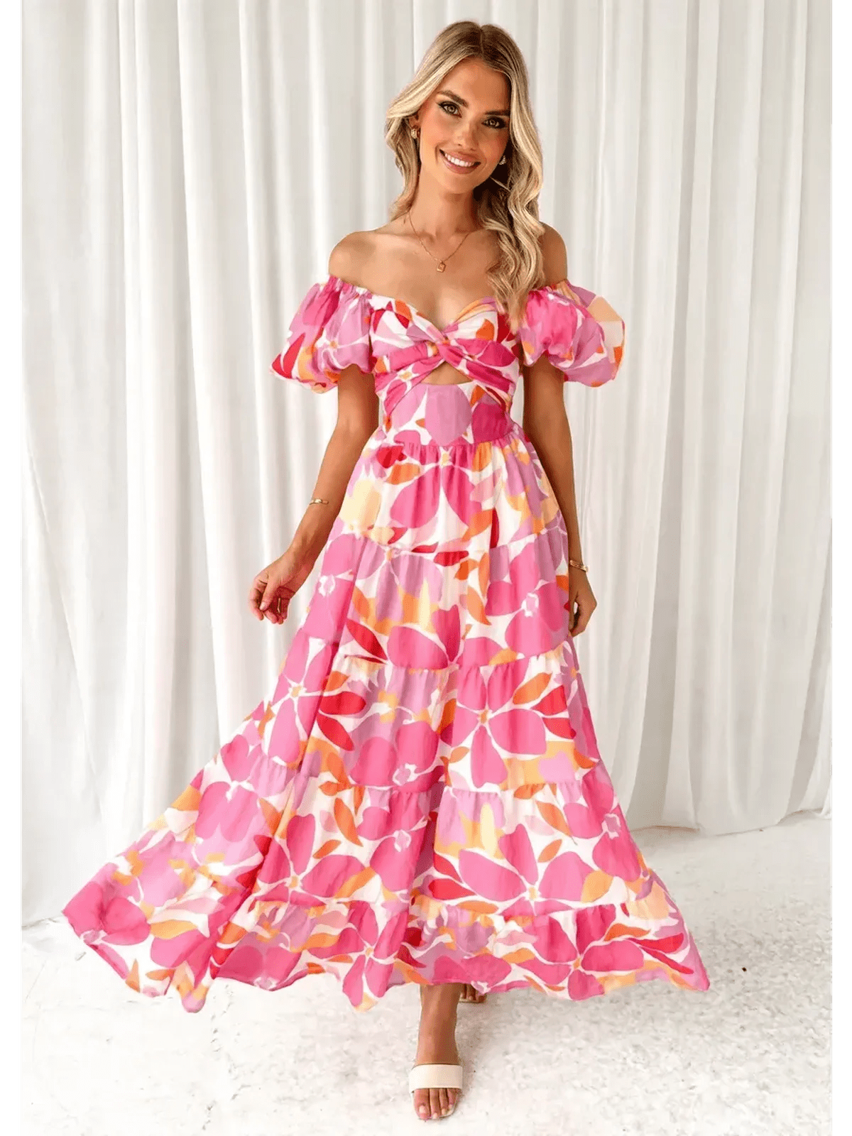 Flora Muse Maxi Dress featuring vibrant floral print, off-shoulder design, and tiered skirt, perfect for summer occasions.