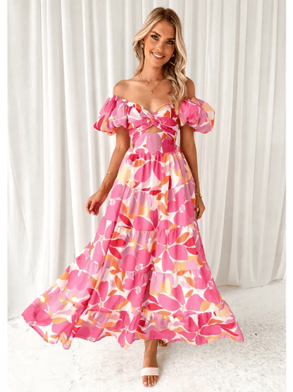 Flora Muse Maxi Dress featuring vibrant floral print, off-shoulder design, and tiered skirt, perfect for summer occasions.