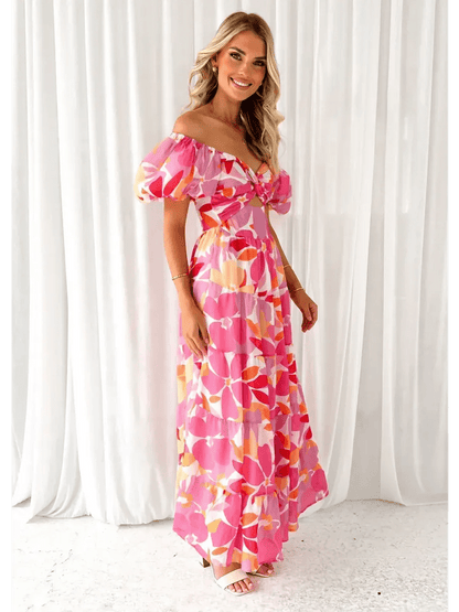 Flora Muse Maxi Dress with vibrant floral prints, off-shoulder design, and puff sleeves, perfect for summer occasions.