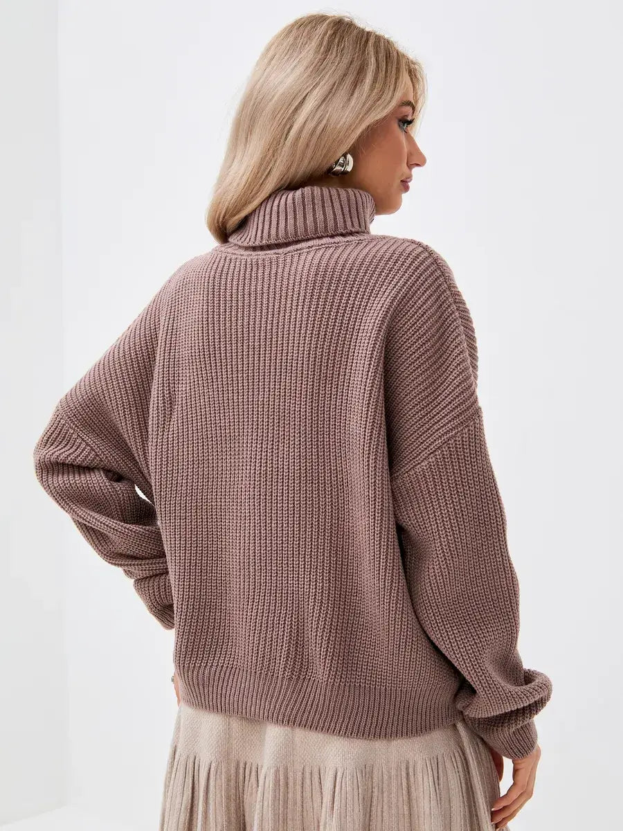 Back view of a woman wearing the oversized Lauven Florence Sweater with turtleneck in warm coffee color.