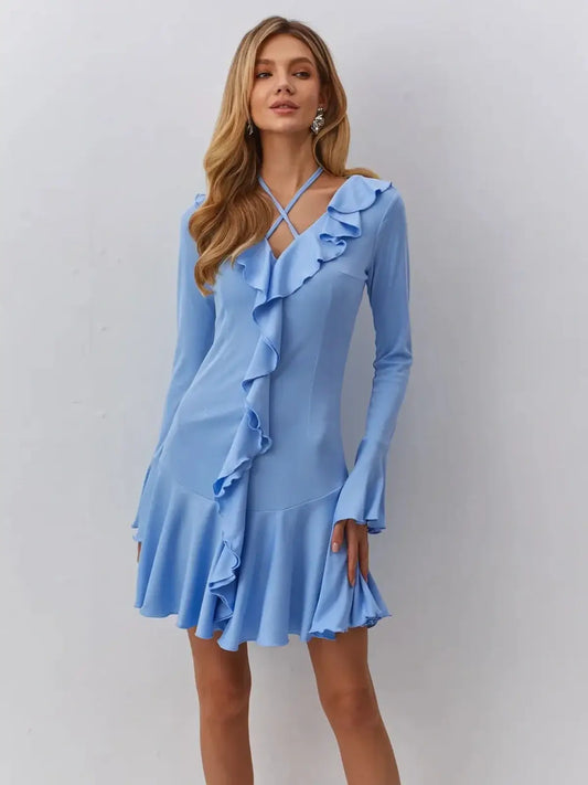Light blue mini dress with ruffled trim and cross-strap V-neckline, perfect for summer weddings or cocktail parties.