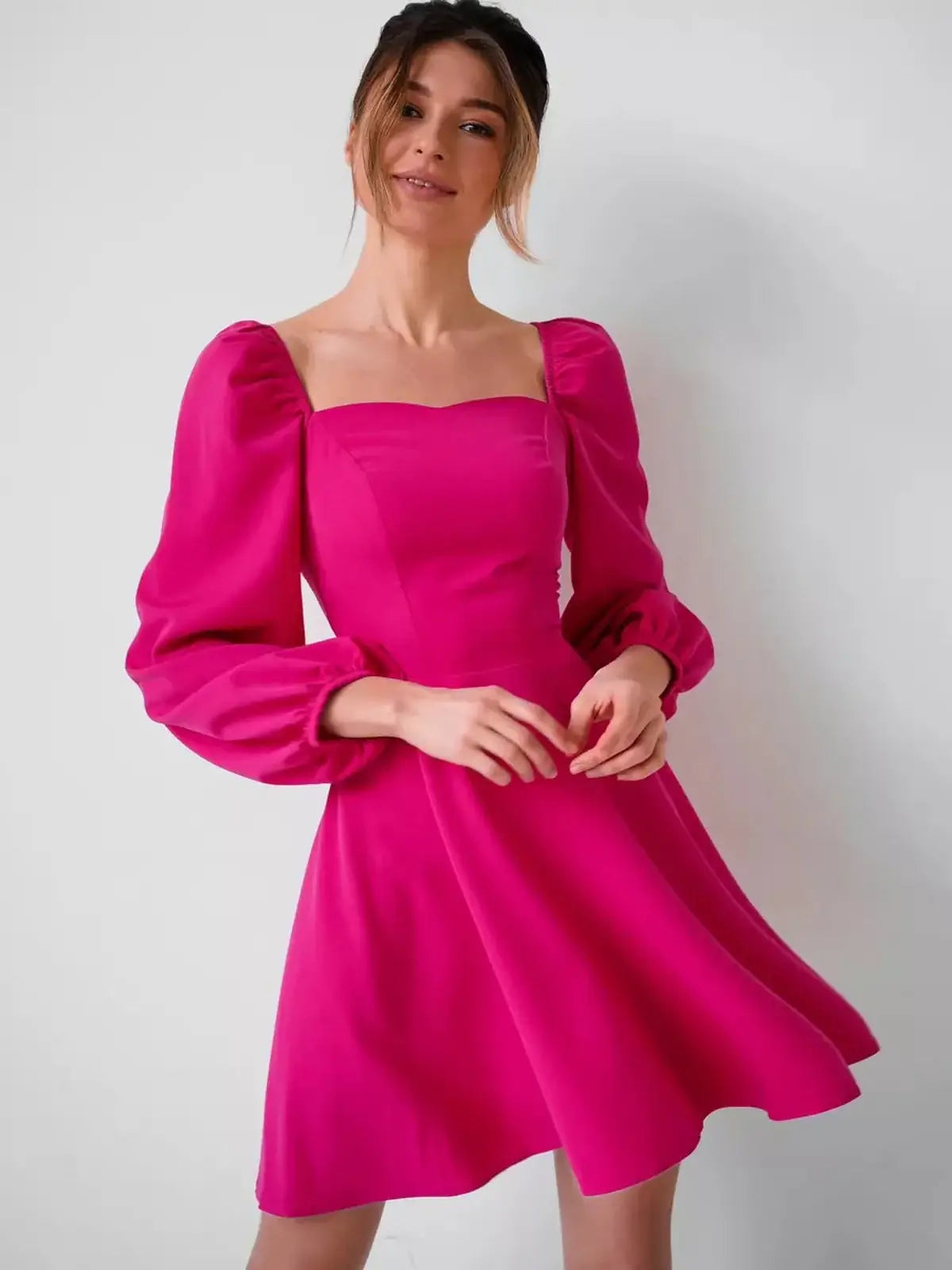 Fuchsia Bloom mini dress with structured square neckline and puff sleeves, perfect for summer and special occasions.