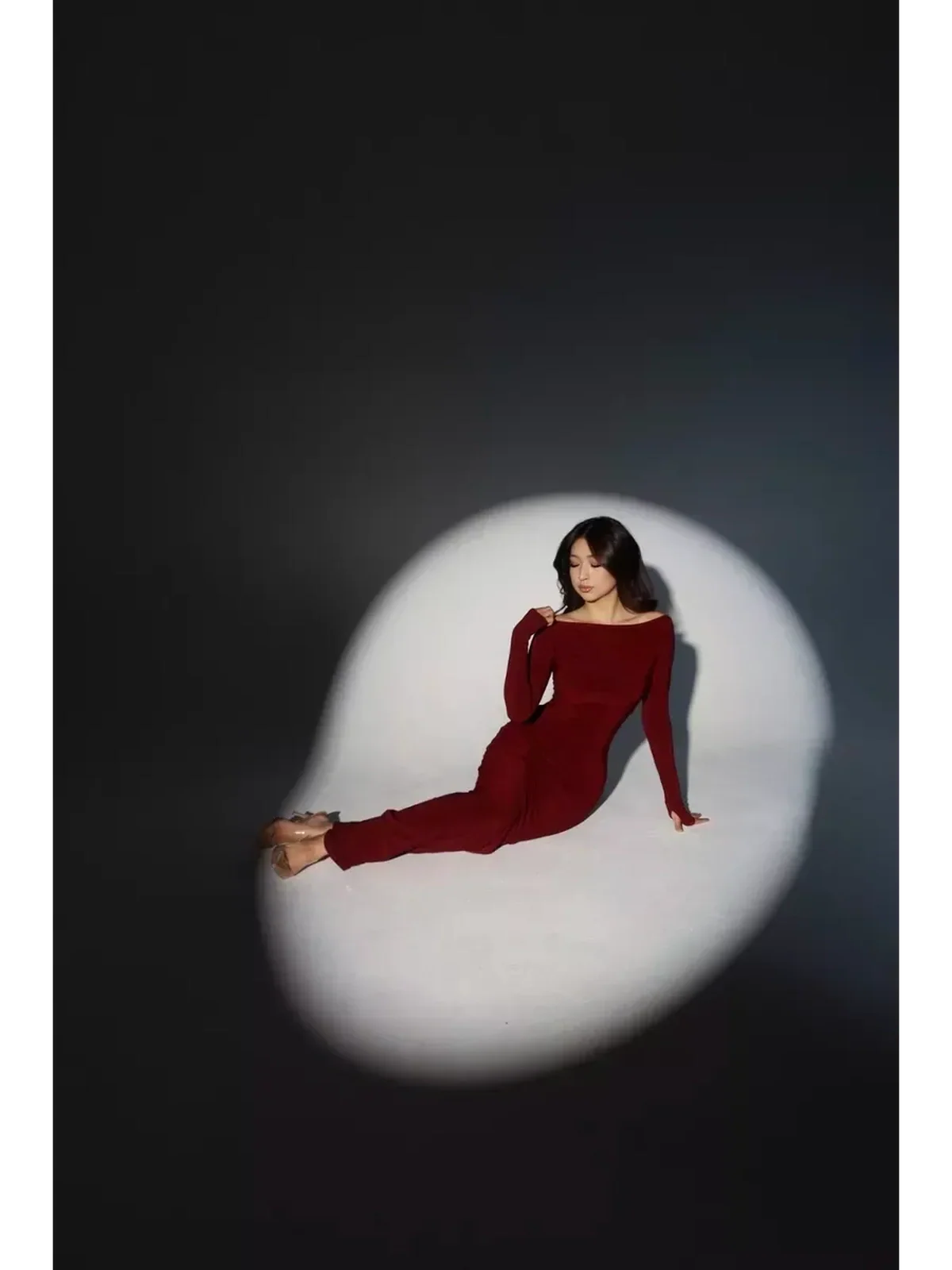 Garnet Sculpt Maxi Dress showcasing a sculpting silhouette with luxe drape and flattering boat neckline.