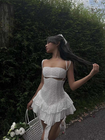 Grace Mini Dress featuring elegant lace detail and a playful flared hem, perfect for summer and special occasions.