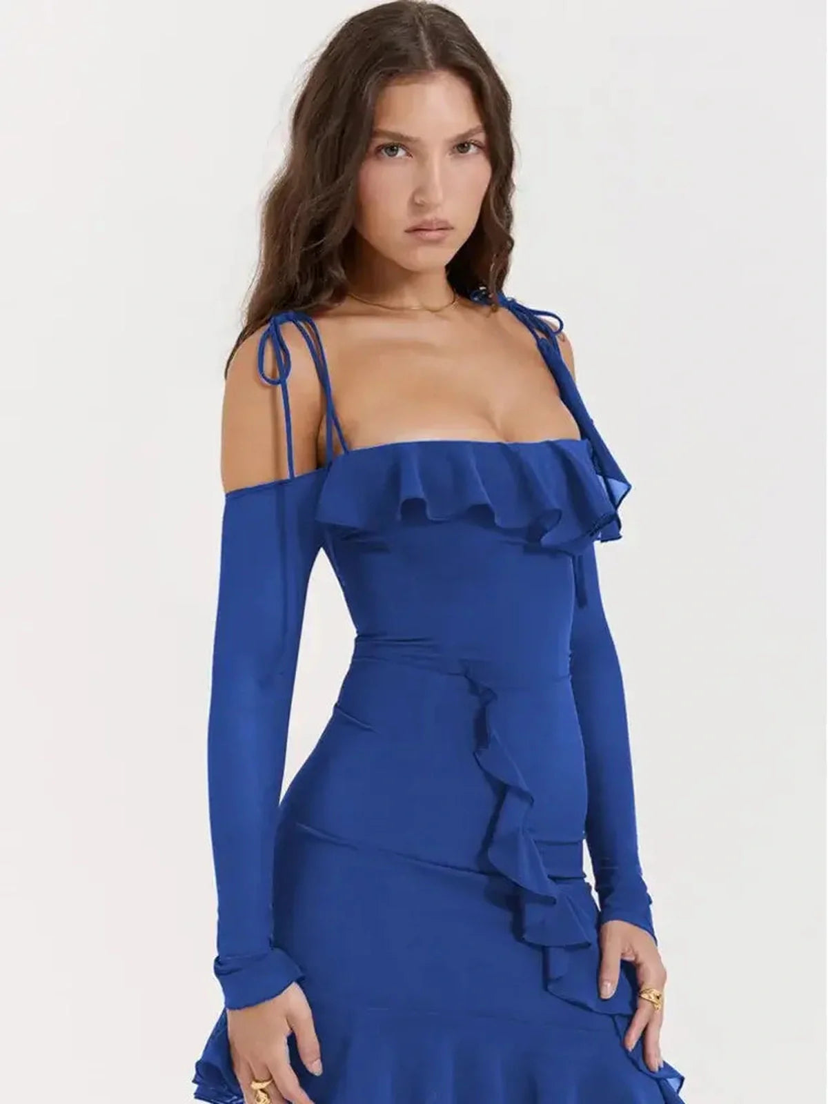 A model wearing a blue off-the-shoulder mini dress with ruffles, perfect for summer or cocktail occasions.
