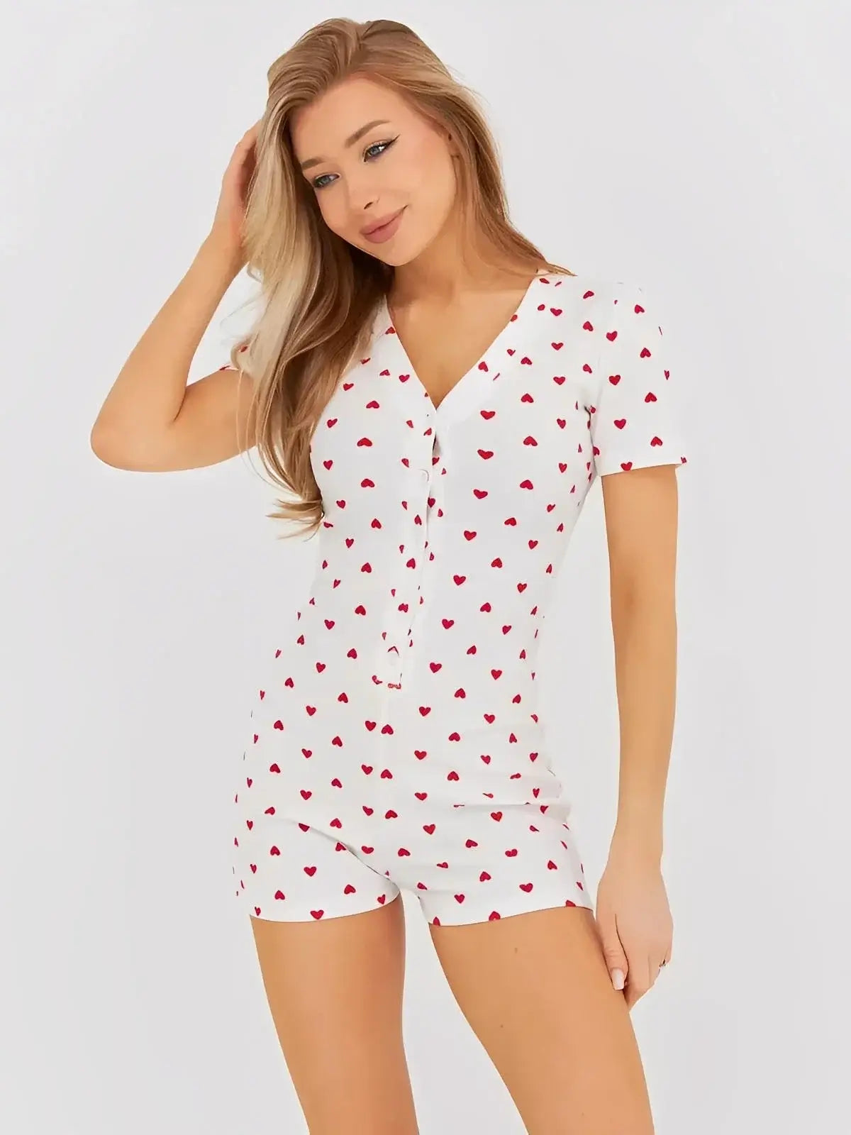 Heartprint Playsuit by Lauven - Soft ribbed knit romper with all-over heart print and V-neckline.