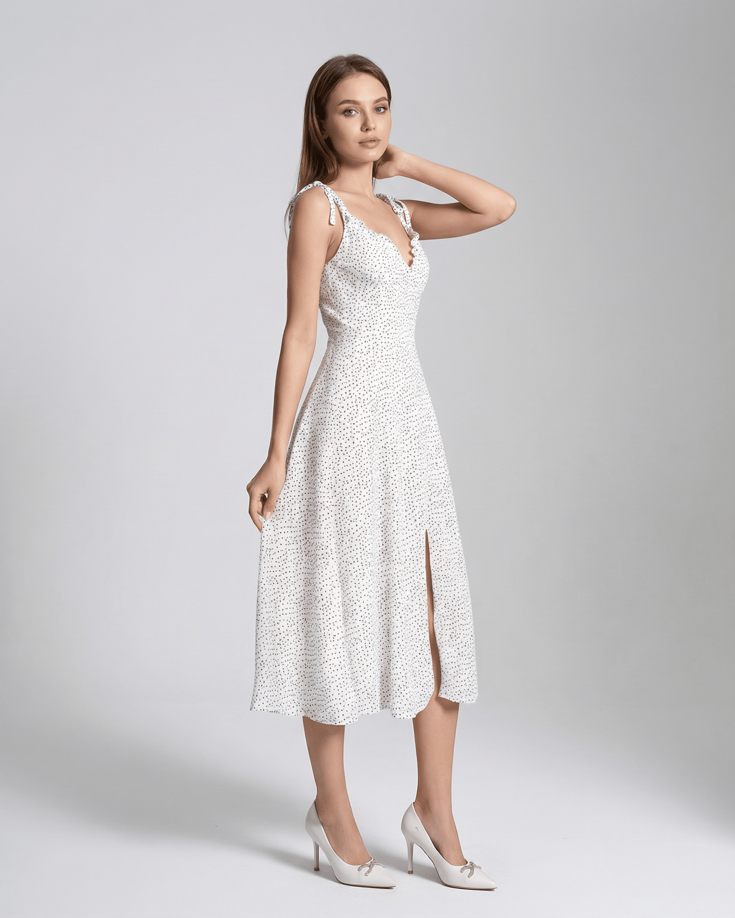 Elara Midi Dress by Lauven, elegant A-line silhouette with polka dot detail and high waist design.