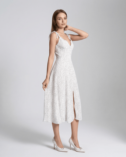 Elara Midi Dress by Lauven, elegant A-line silhouette with polka dot detail and high waist design.