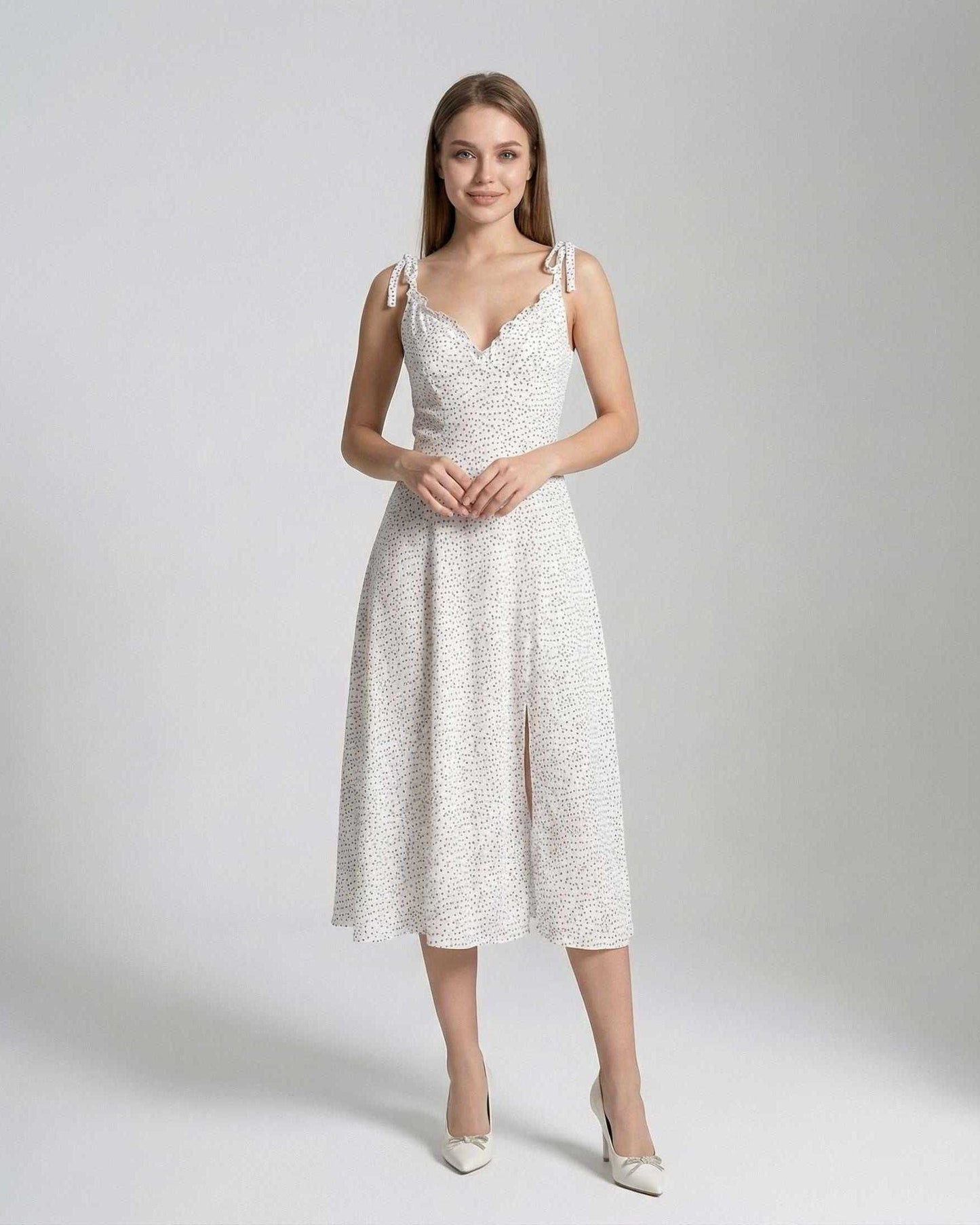 Elara Midi Dress by Lauven, featuring a sleeveless A-line silhouette with polka dot detail, perfect for elegant occasions.