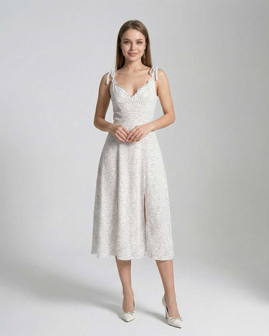 Elara Midi Dress by Lauven, featuring a sleeveless A-line silhouette with polka dot detail, perfect for elegant occasions.