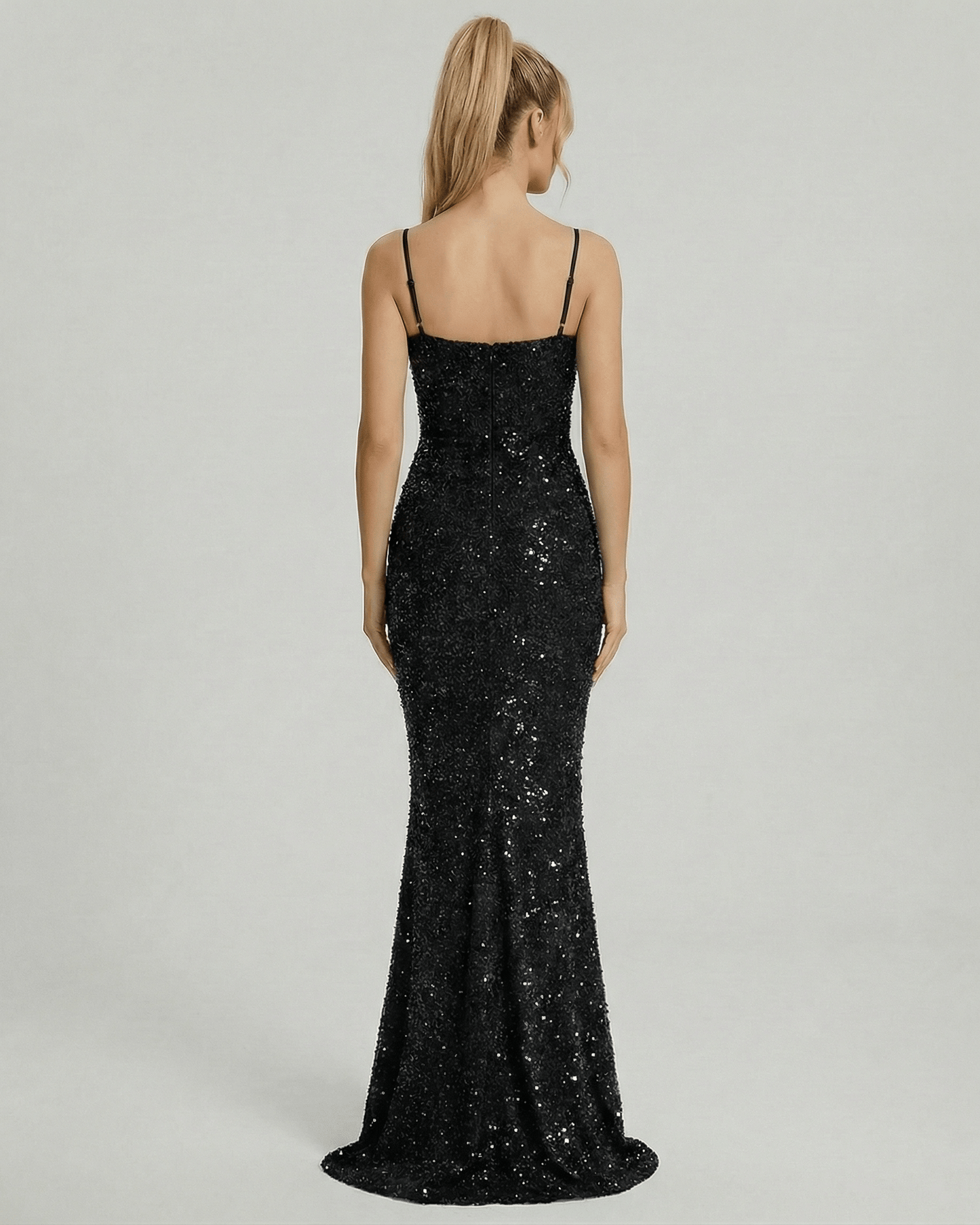 Back view of the Lyra Maxi Dress by Lauven, a glamorous black sequin mermaid gown with spaghetti straps.