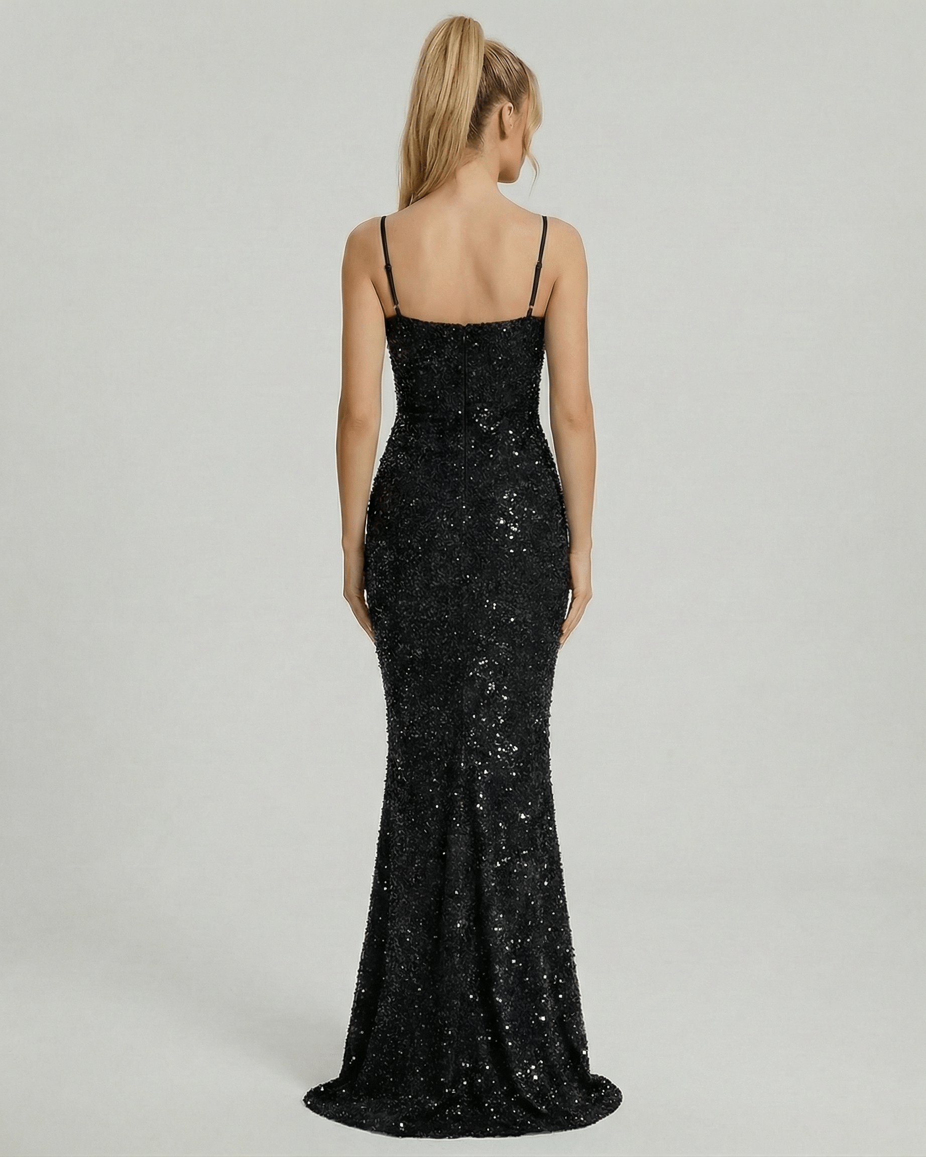 Back view of the Lyra Maxi Dress by Lauven, a glamorous black sequin mermaid gown with spaghetti straps.