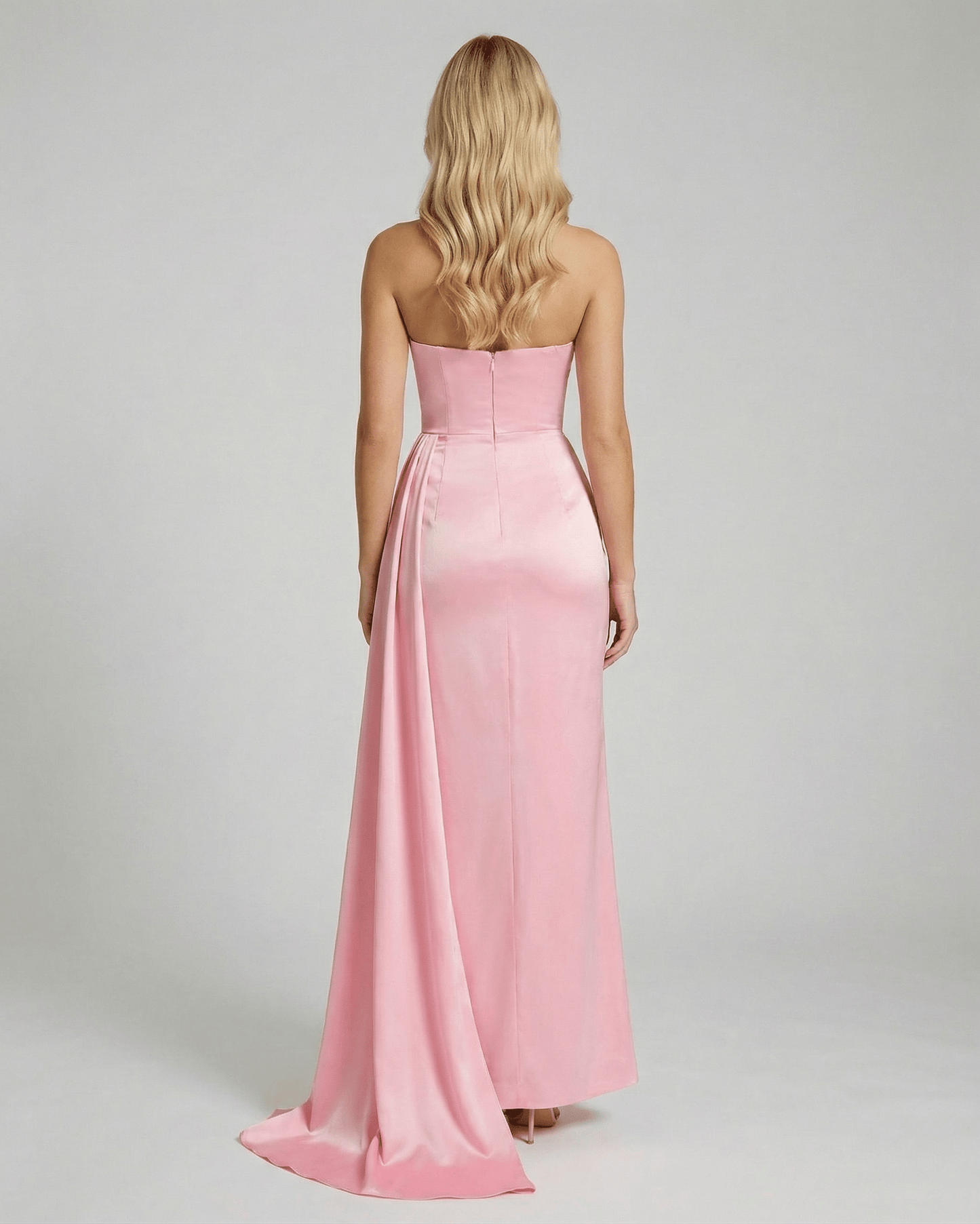 Back view of Celeste Maxi Dress by Lauven, showcasing elegant pink satin fabric and a sleek silhouette.