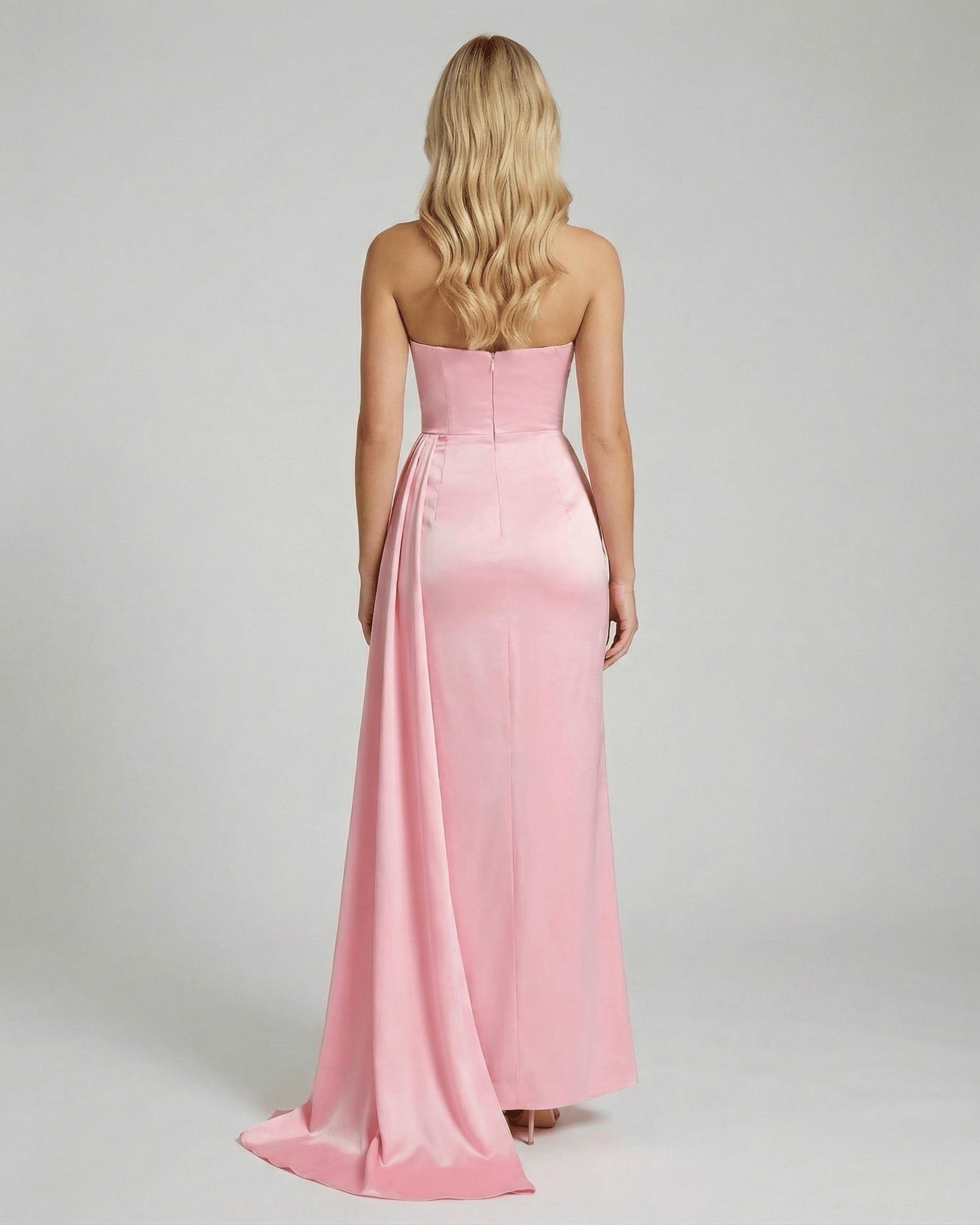 Back view of Celeste Maxi Dress by Lauven, showcasing elegant pink satin fabric and a sleek silhouette.