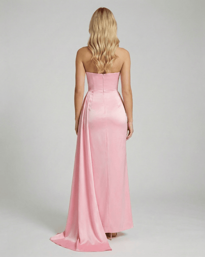 Back view of Celeste Maxi Dress by Lauven, showcasing elegant pink satin fabric and a sleek silhouette.