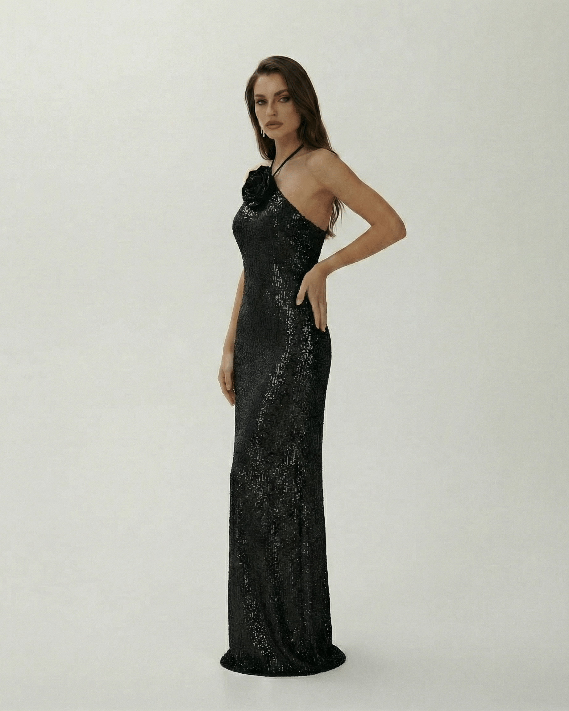 Noctura Maxi Dress by Lauven, elegant black sequin halter evening gown with floral embellishment.