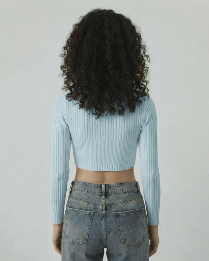 Celeste Top by Lauven, women's light blue ribbed knit long sleeve top, back view, showing modern cut-out style.