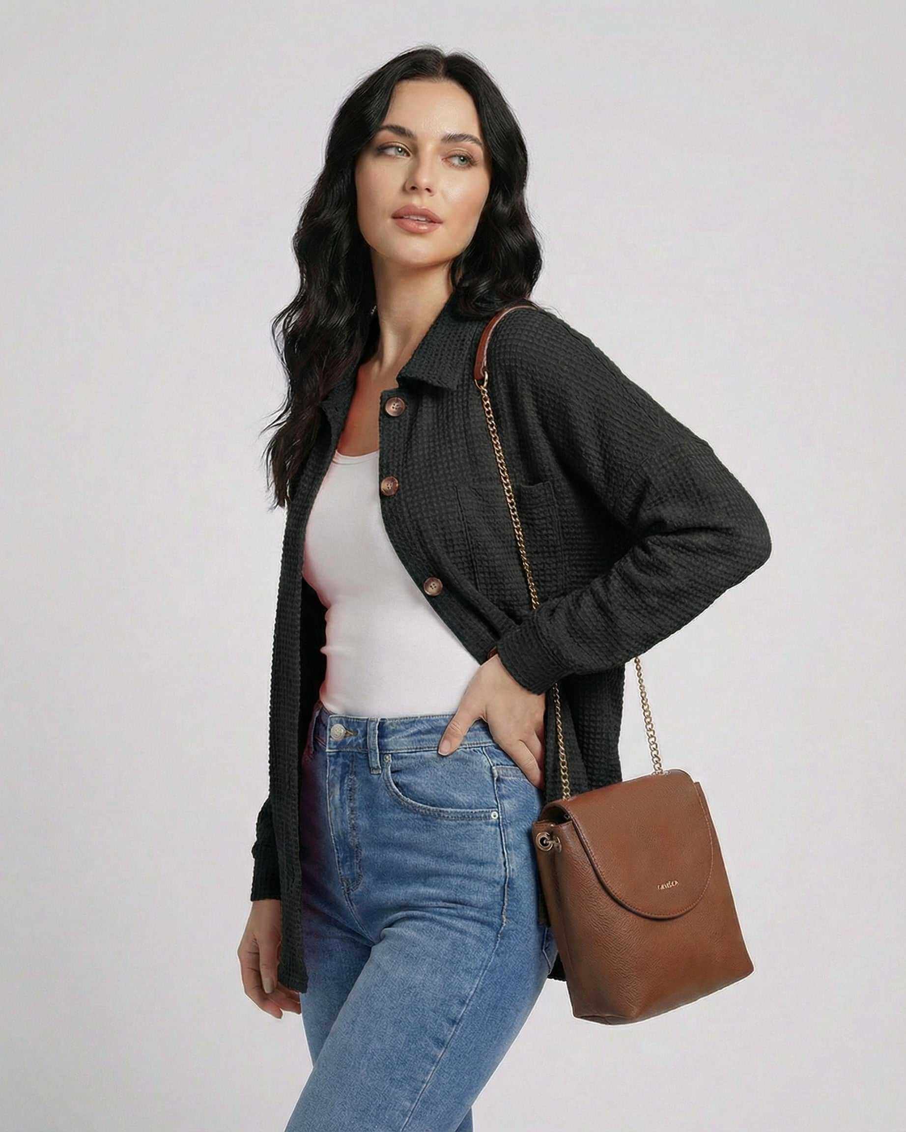 Milano Jacket by Lauven - Women’s black waffle knit jacket with longline fit, paired with a stylish handbag.