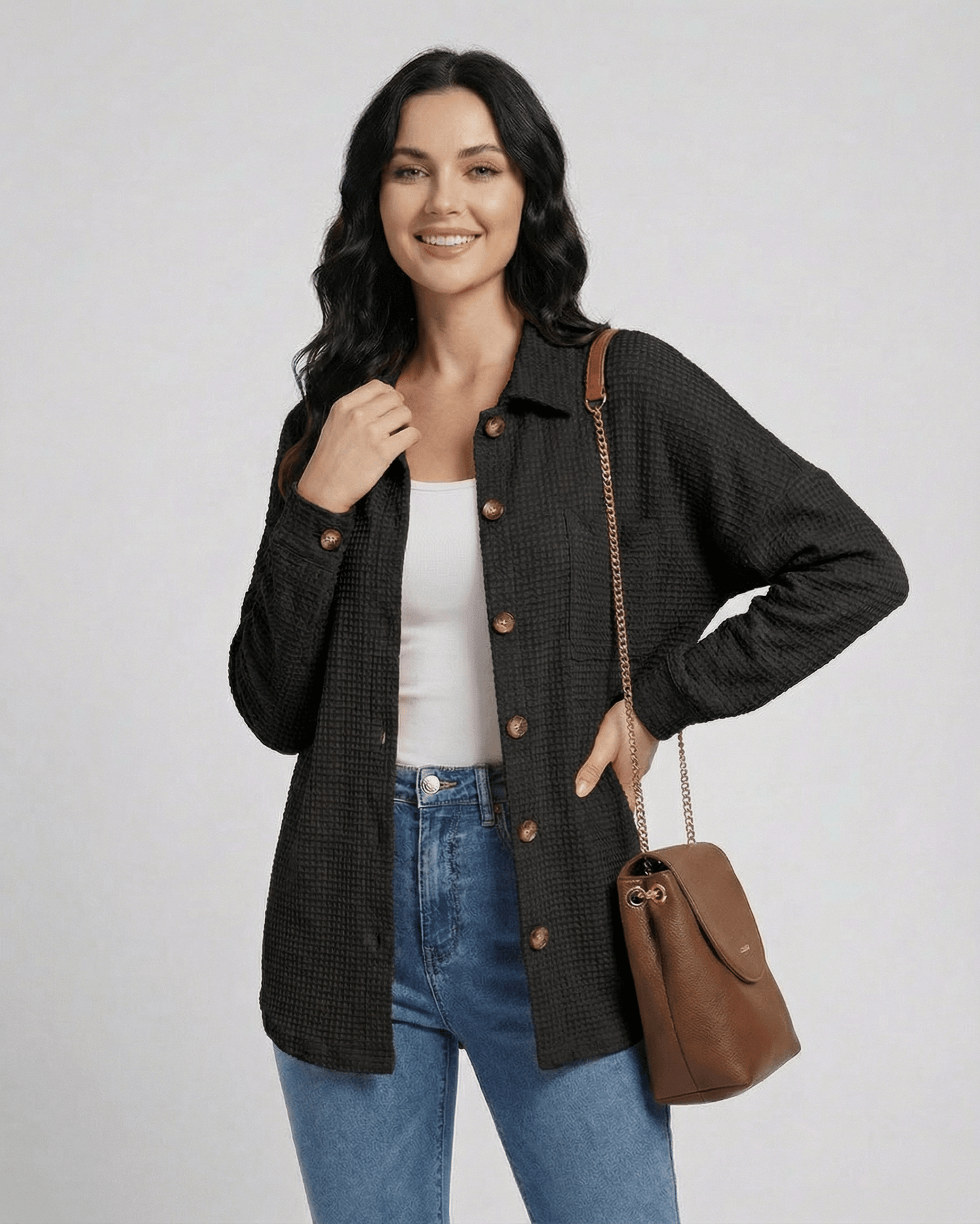 Women wearing Milano Jacket by Lauven, a black waffle knit longline jacket with casual fit.