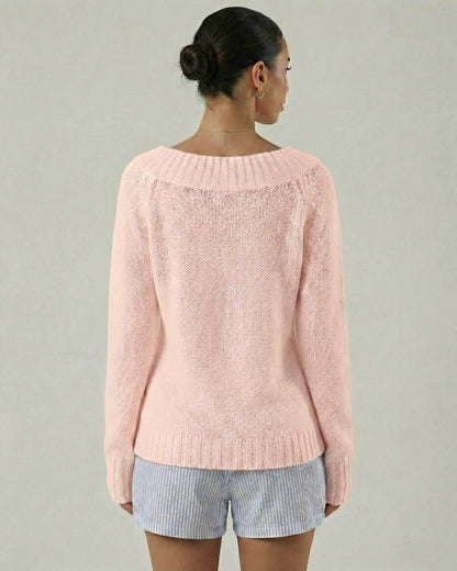 Back view of the Rosaline Sweater by Lauven, a women's pink boat neck sweater with rib knit detail.