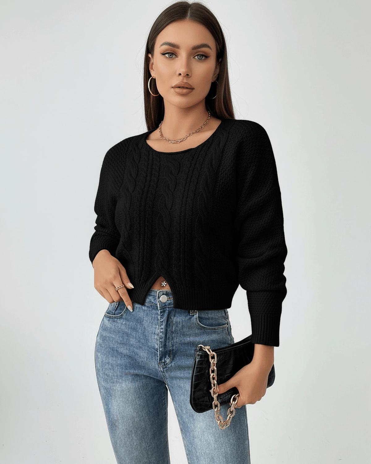 Noelle Sweater by Lauven – Women’s black cable knit cropped sweater styled with jeans.