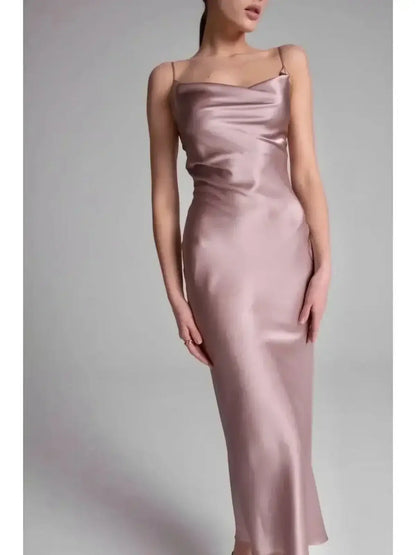 Model showcasing the Roselle Midi Dress in luxe satin, featuring a sleek silhouette and elegant rose color.