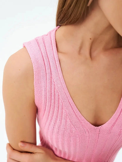 Close-up of Rosalie Midi Dress showing soft pink ribbed knit texture and refined V-neckline by Lauven.