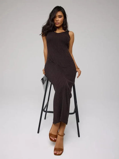 Model wearing Cacao Maxi Dress by Lauven, a chic brown ribbed knit dress that flatters the figure.