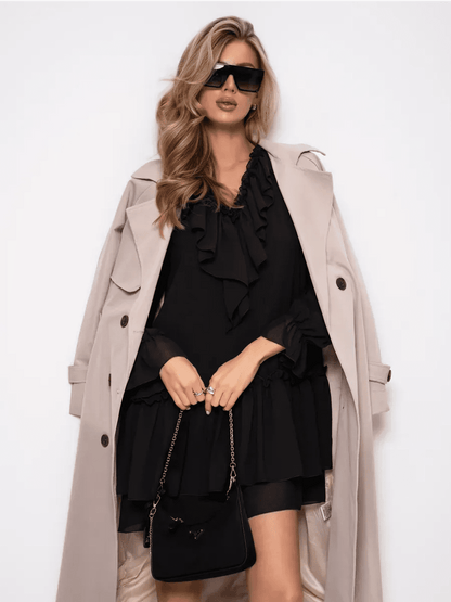 Model showcasing the Noirelle Mini Dress by Lauven, featuring ruffled layers and a sophisticated black chiffon design.