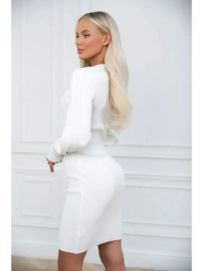 Model showcasing the Ivory Curve white mini dress with long voluminous sleeves and fitted silhouette from the back.