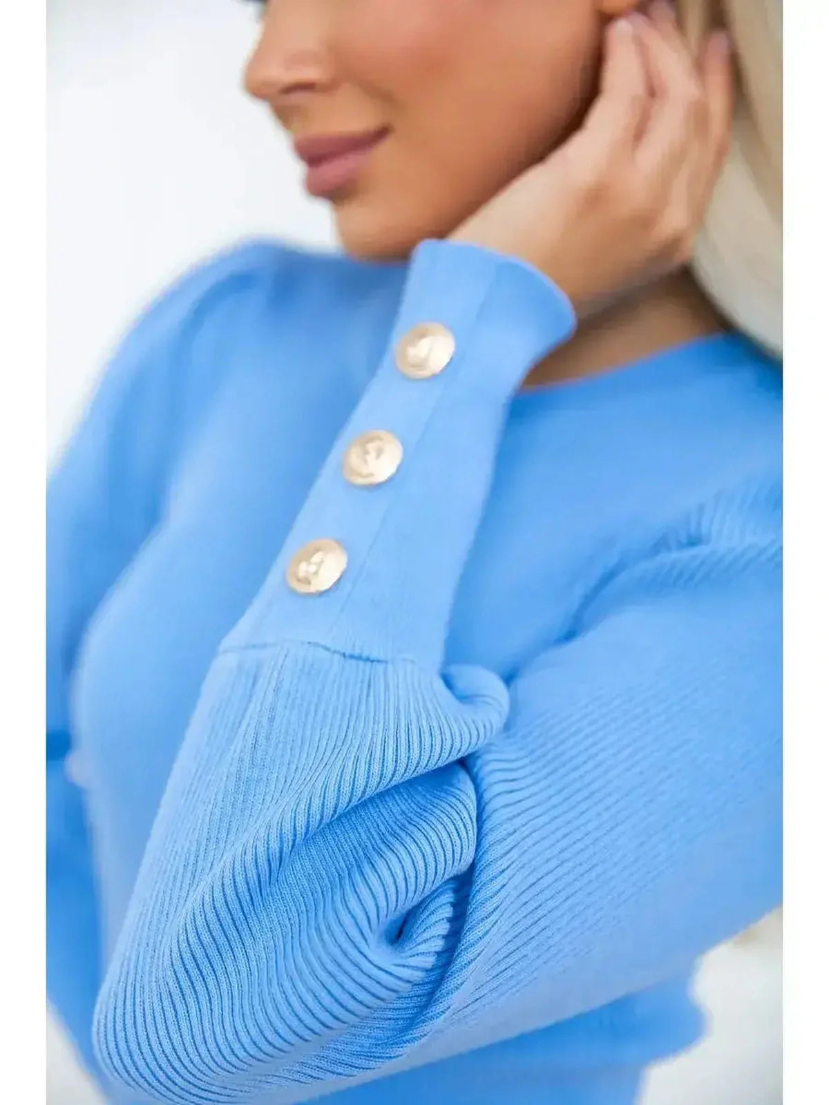 Close-up of the Azure Mini Dress highlighting ribbed texture and gold-tone buttons on the cuff for a stylish look.