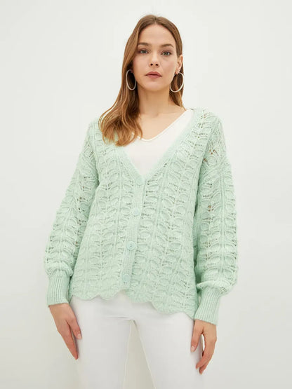 Celestia Cardigan from Lauven, featuring a soft green jacquard knit and V-neckline for versatile layering.