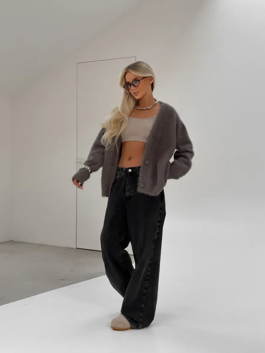 Vega Cardigan by Lauven, oversized gray fluffy knit with button closure, styled with relaxed black pants.