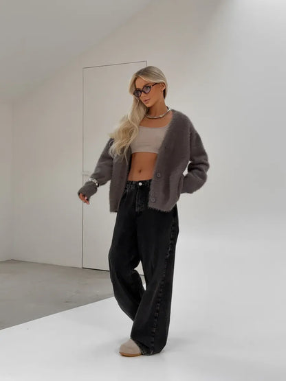 Vega Cardigan by Lauven, oversized gray fluffy knit with button closure, styled with relaxed black pants.