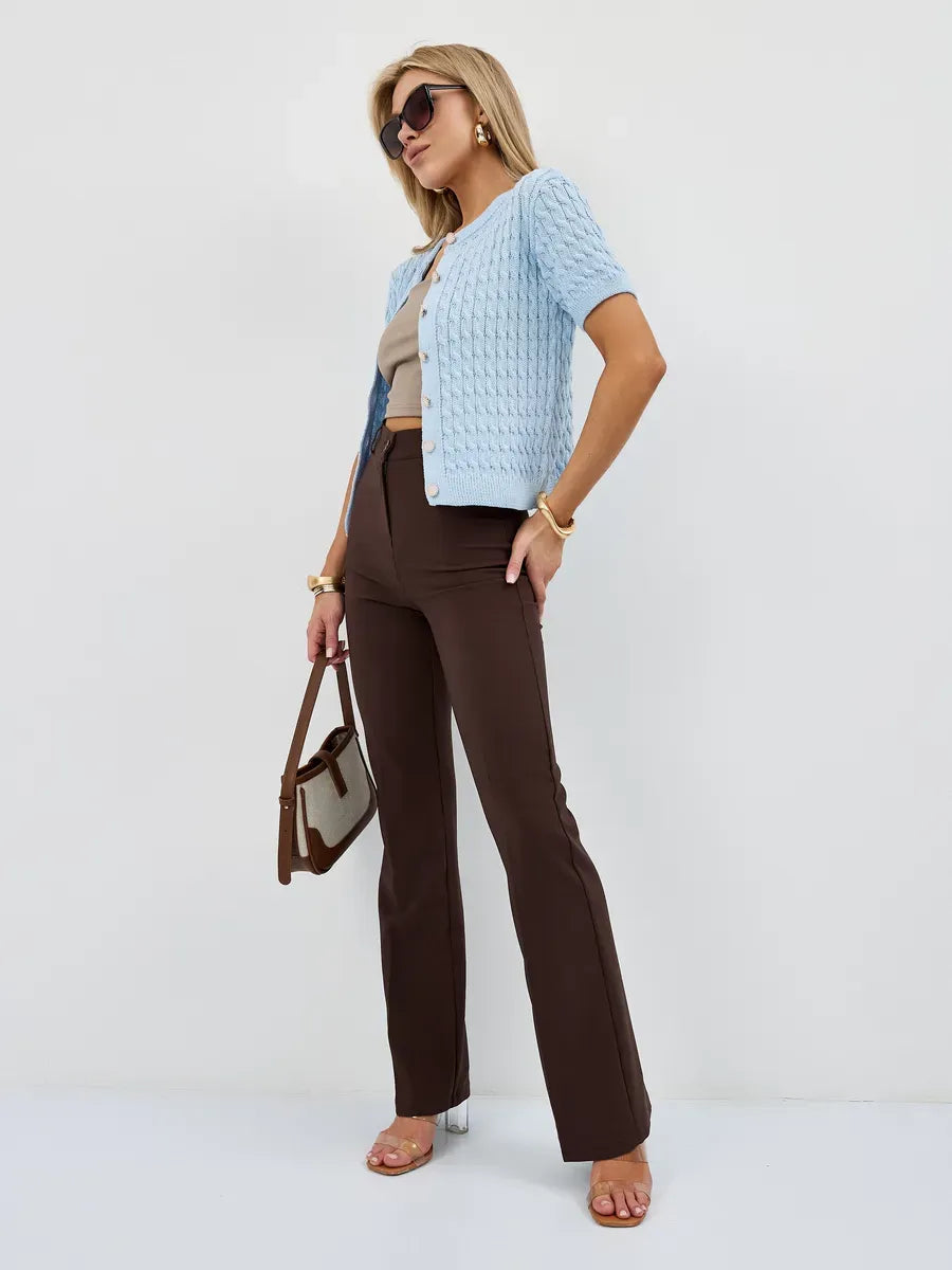 Celeste Cardigan by Lauven, breathable cotton-acrylic knitwear, styled with brown flared pants and sunglasses.