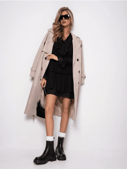 Model wearing Lauven Noirelle Mini Dress with a trench coat, stylish boots, and sunglasses.