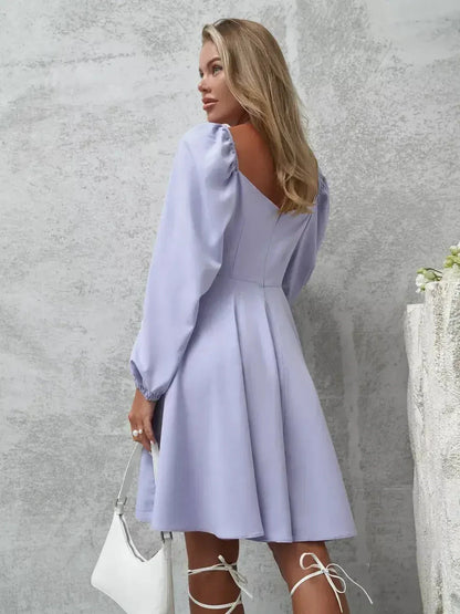 Elegant lilac mini dress with voluminous sleeves and V-neckline, perfect for turning heads.