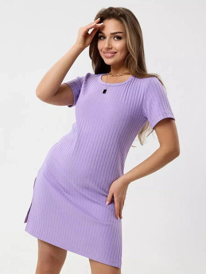 Model showcasing a curve-hugging lilac mini dress with ribbed texture and short sleeves, perfect for warm days.