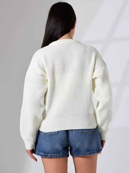 Back view of the Luna Cardigan by Lauven, showcasing elegant knitwear for women in a soft, milk color.